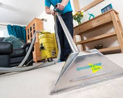 servicemaster technician cleaning carpet