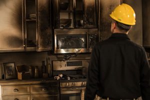 man facing damage from a kitchen fire